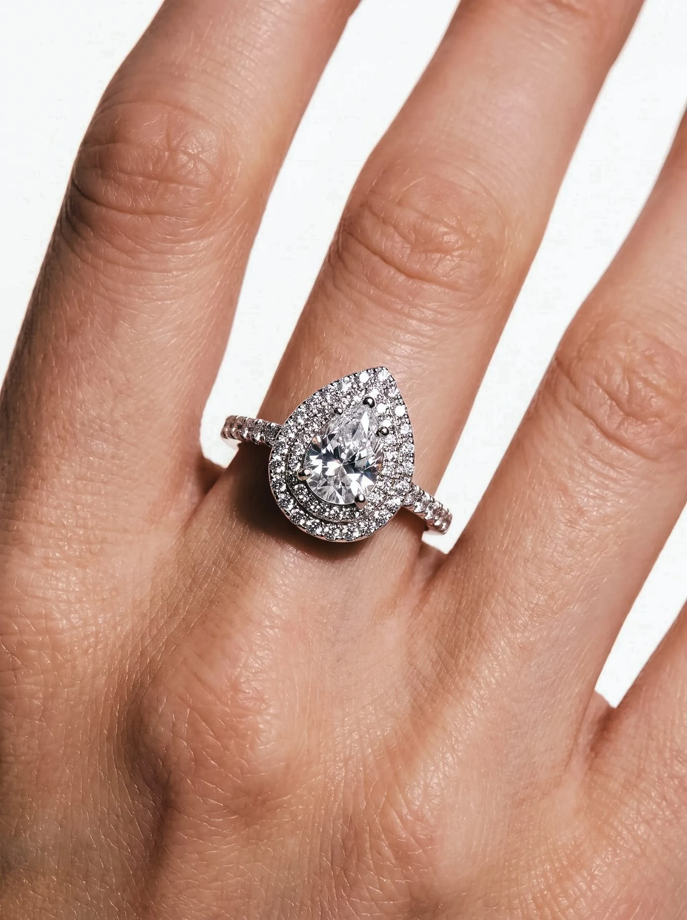 Halo Ring, No. 003, a pear diamond in a double halo, worn on the hand